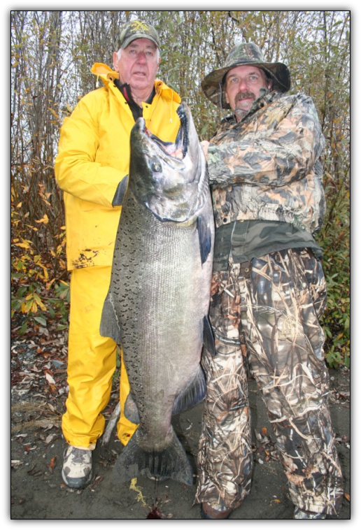 Wayne and Dave Smith of Yreka, Calif., hold the 65-pound king salmon they caught in November 2011 while fishing with pro guide Andy Martin of Wild Rivers Fishing. The giant salmon is the unofficial Chetco River record. No one gets clients into more trophy kings on the Chetco than Andy Martin and the other guides of Wild Rivers Fishing.